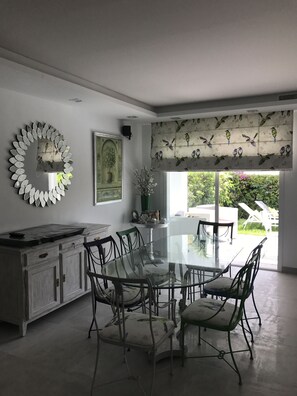 Enjoy meals in this stylish dining area with a glass-top table and comfortable seating for six.