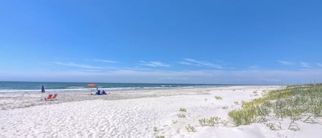 On the beach, sun-loungers