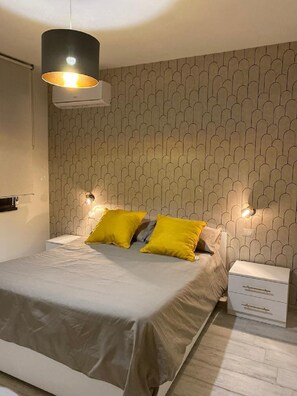 1 bedroom, desk, iron/ironing board, travel crib