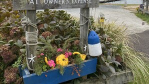 A wooden sign with text indicating it is a private marina for HIA members with towing enforced at the owner's expense. - Private home, short walk to Harbour Island beach! Central A/C, family friendly! (Narragansett)