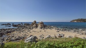 A rocky beach with large boulders and clear blue water. - Lovely home in Scicli (Scicli)