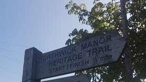 A directional signpost with 'Northwick Manor Heritage Trail' and 'The Slip' written on it. - The Coneygree @ Northwick (Worcester)