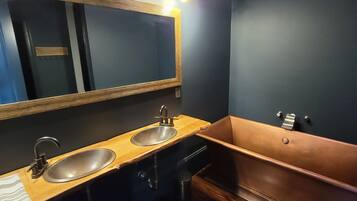 Bathtub, hair dryer, towels, soap