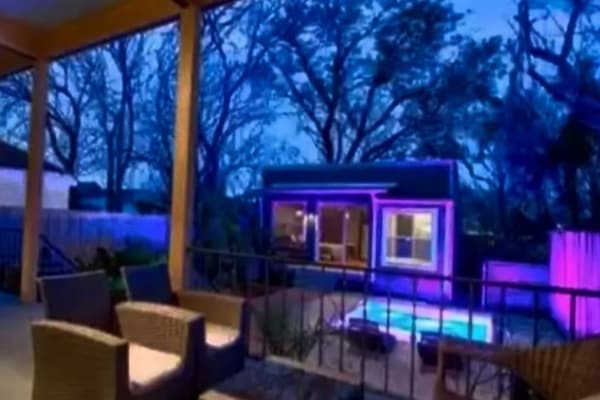 Backyard and pool illu.inating at dusk