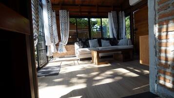 Superior Cabin | Living area | 32-inch flat-screen TV with cable channels, TV