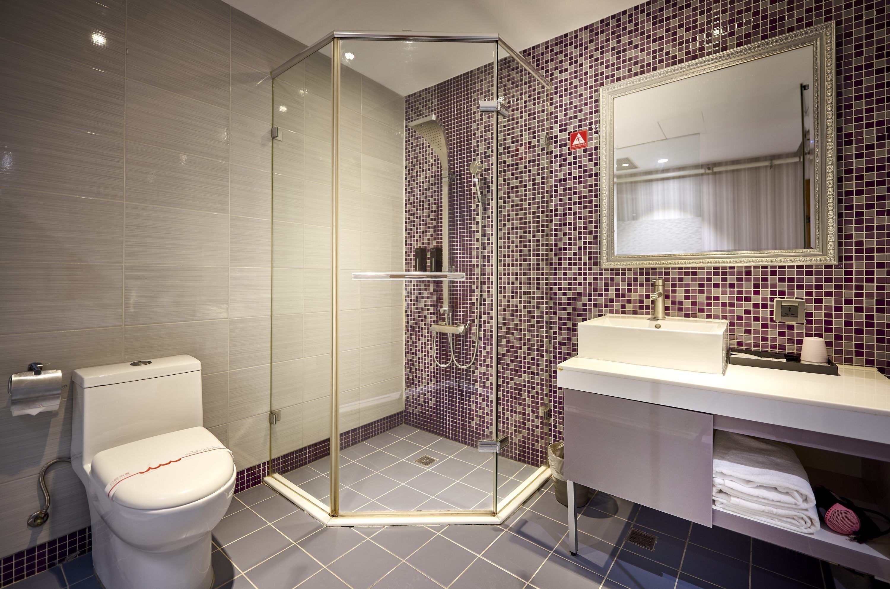 standard twin room | bathroom | shower, eco-friendly toiletries, hair dryer, towels