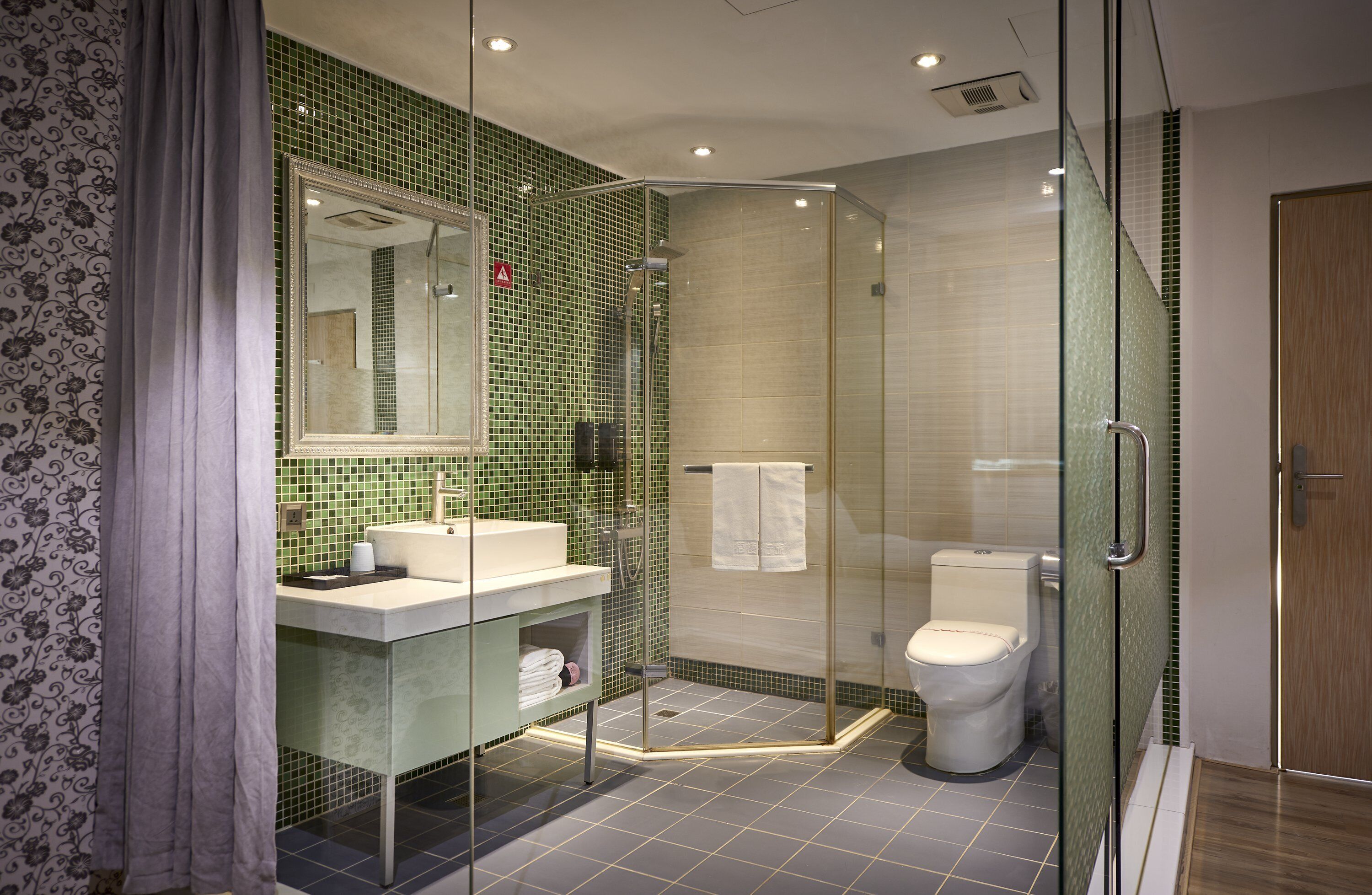 standard twin room | bathroom | shower, eco-friendly toiletries, hair dryer, towels