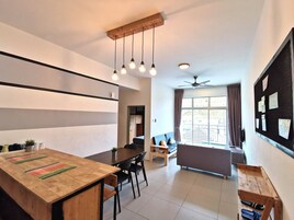 The Woodz x Loft | Living area | Flat-screen TV