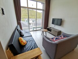 The Woodz x Loft | Living area | Flat-screen TV