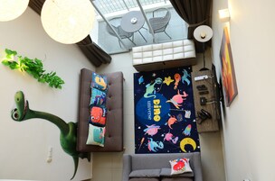 The Woodz x Big Dino | Living area | Flat-screen TV