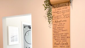 A welcome sign with favorite spots and activities in a hallway.