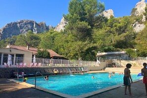 Seasonal outdoor pool, open 9:00 AM to 7:00 PM, sun loungers
