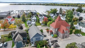 A residential area with houses, a marina, and a lake.