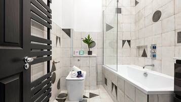 Bathtub, hair dryer, towels