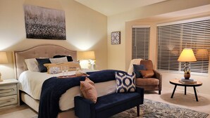 A bedroom with a bed, bedside tables, a chair, a lamp, and a window with blinds. - Renovated WATERSLIDE private Heated pool with Spa Golf Course on-call service  (Mesa)