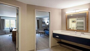 A modern bathroom with a large mirror, a sink, and a shower area. - Aiden By Best Western Cape Cod - West Yarmouth (West Yarmouth)