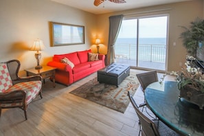 Living room with large balcony and queen-size sofa-bed 