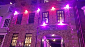 A building with a sign reading "The Lever Restaurant" above an entrance. - OYO The Leven (Middlesbrough)