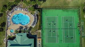 An aerial view of a resort with a swimming pool, tennis courts, and a covered area. - 🏖️ Maravilla ~ private beach ~ includes beach setup of 4 chairs, 2 umbrellas 🏖️ (Miramar Beach)