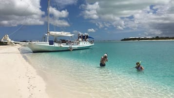 On the beach, sun loungers, beach towels