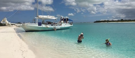 On the beach, sun loungers, beach towels