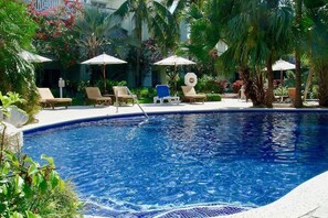 Outdoor pool, a heated pool - Spectacular Beachfront Condo, Ocean Views of Grace Bay, Suite #123 (Providenciales)