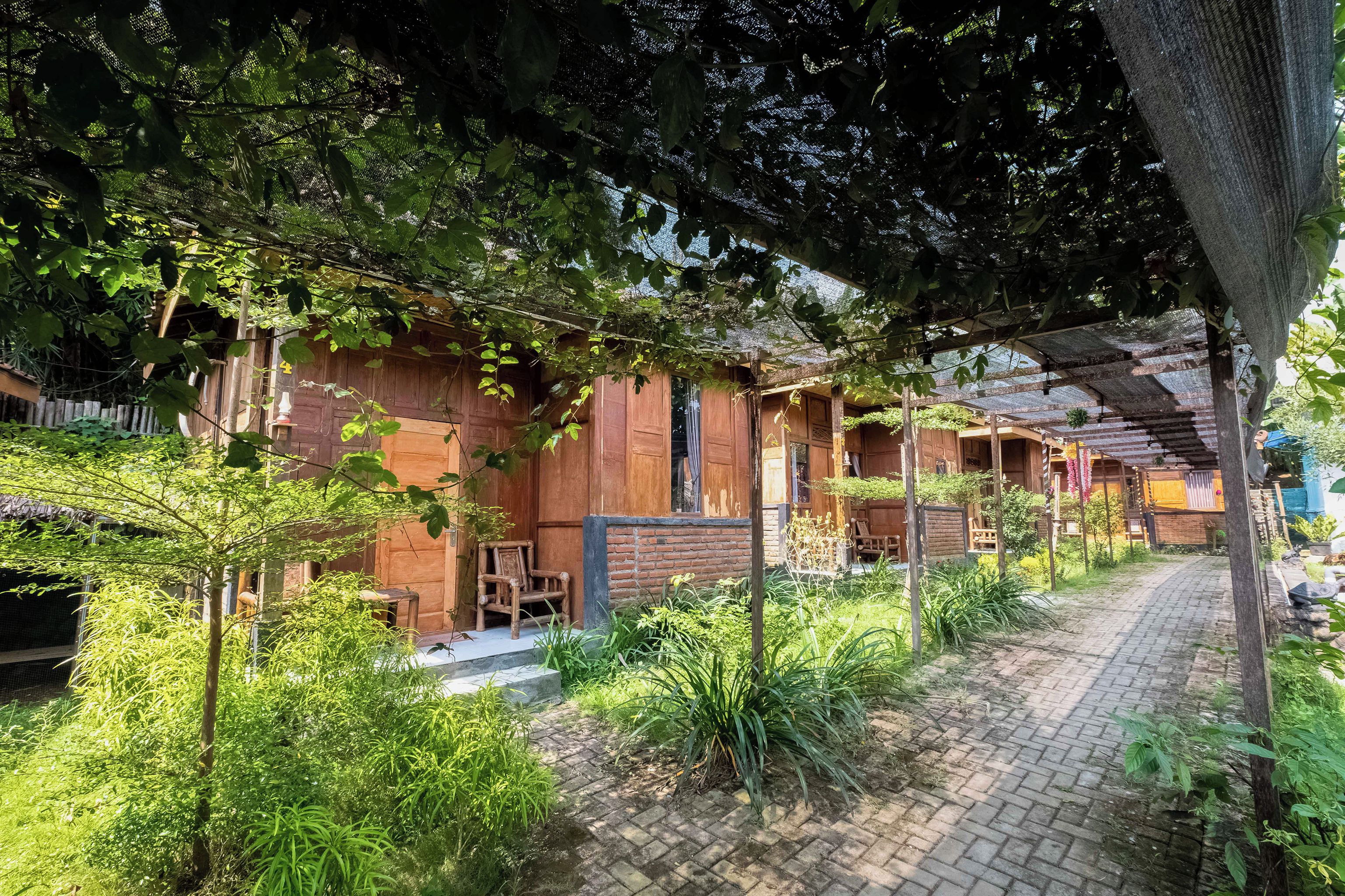 A rustic wooden building with a brick pathway leading to the entrance.