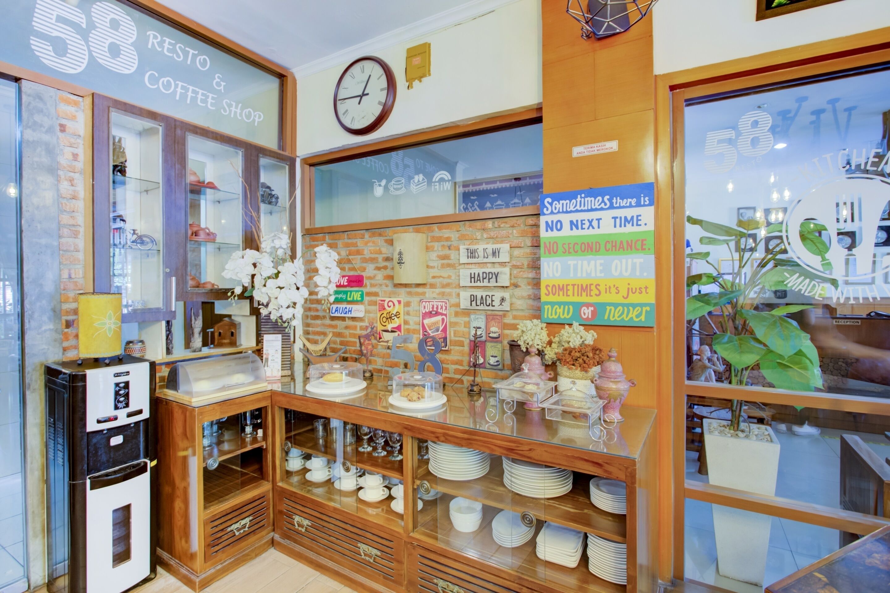 A coffee shop with a rustic interior, including a brick wall, wooden shelves, and a coffee machine.