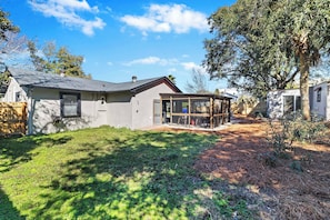 A residential property with a detached house, a fenced backyard, and a covered outdoor area. - Beachy Isle of Palms Private Bungalow! Walk to Beach! Pet Friendly. (Isle of Palms)