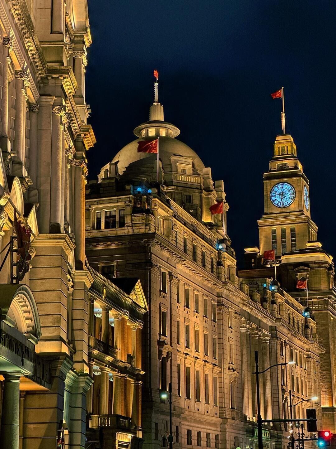 A historic building with classical architecture, including a prominent dome and clock tower.