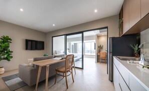 Suite Exécutive | Coin séjour | Télévision à écran plat