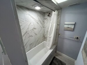 Combined shower/tub, hair dryer, towels, soap