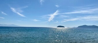 Luxurious Villa, designer's pool, lighted tennis court, olive grove, sea views.