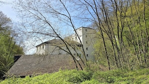 A building with a tiled roof, surrounded by trees and greenery. - Bendorf Hotel by Belvilla (Bendorf)