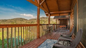 A wooden deck with a view of a hilly landscape. - ⛰️Tuscan Vista🍃Pet Friendly, Fenced Yard, Single-Level, Hot Tub & Game Room (Sevierville)