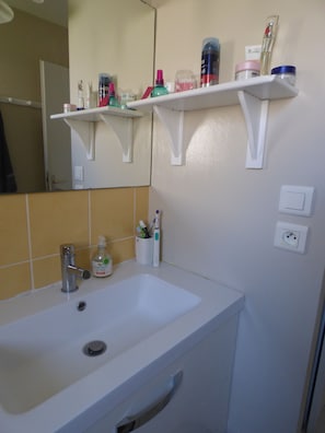 Bathtub, hair dryer, towels, soap