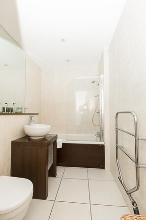 Shower, hair dryer, towels, shampoo