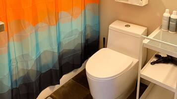 Bathtub, towels, soap, toilet paper