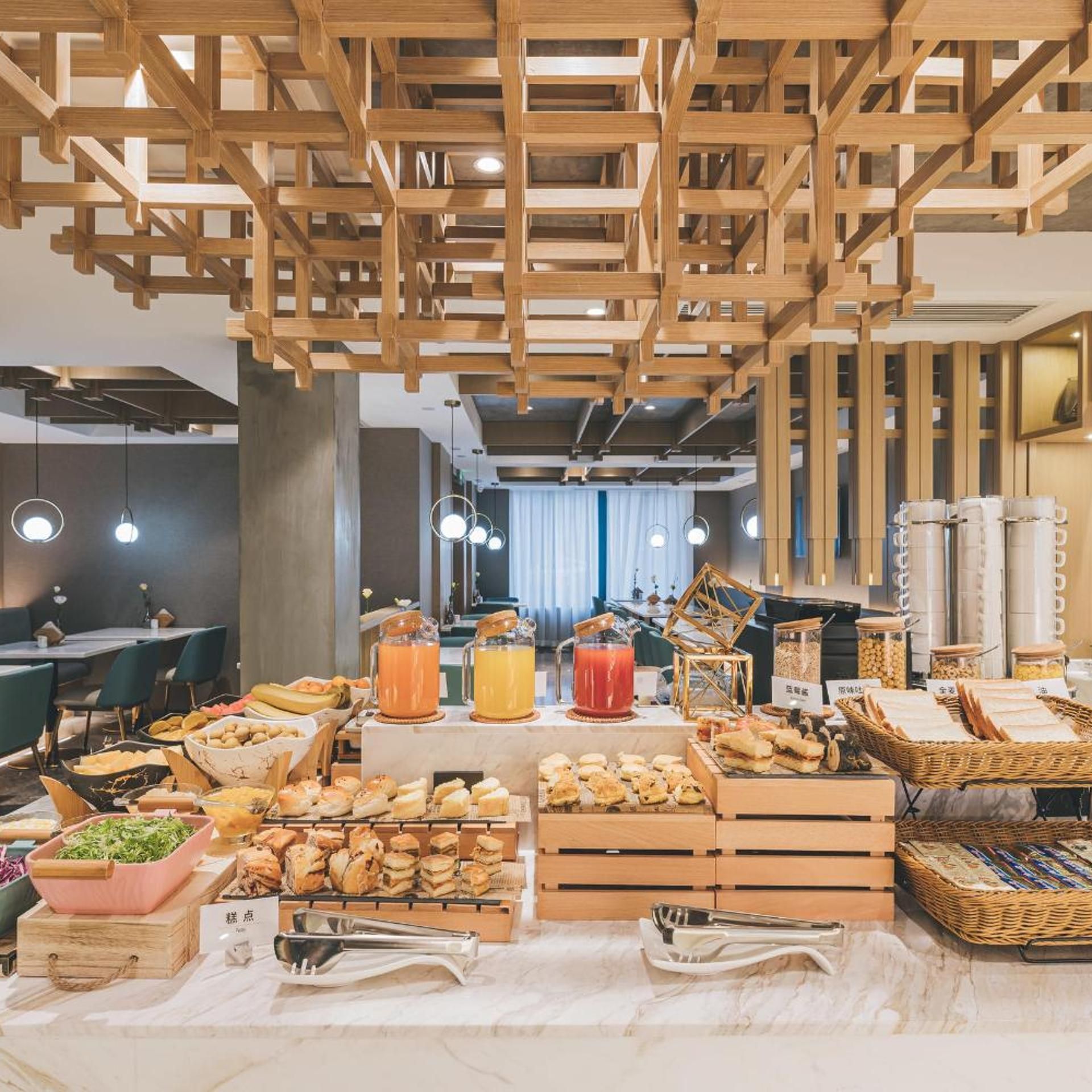 A breakfast buffet with various food items and beverages.