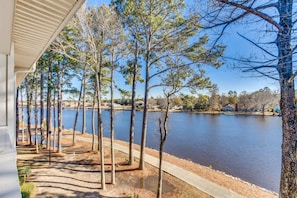 Stroll along the lakeside pathway, surrounded by trees and serene views.