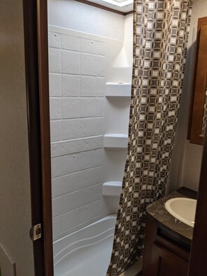 Shower, hair dryer, towels, soap