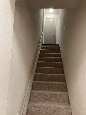 Staircase leads to a door at the top.