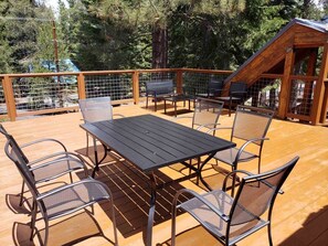 Enjoy al fresco dining on the deck with a table and chairs.