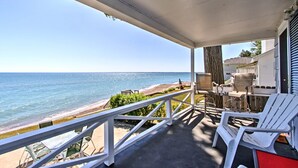 A balcony with a view of the beach and ocean. - Fort Gratiot Lake House on Lake Huron w/ Patio & Deck! (Fort Gratiot Township)
