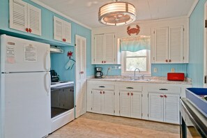 Fridge, microwave, oven, stovetop - A Carolina Dream / 117 SE 55th Street - Coastal Vacation Resorts (Oak Island)