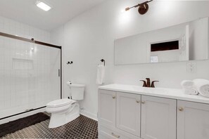 Shower, hair dryer, towels, shampoo
