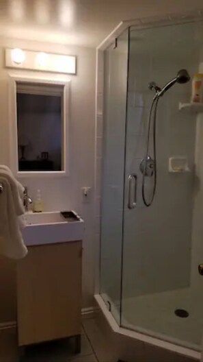 Shower, hair dryer, towels, soap