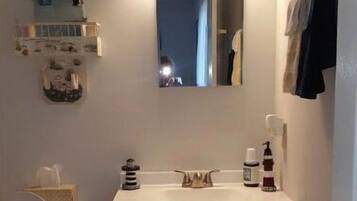 Combined shower/tub, hair dryer, towels, soap