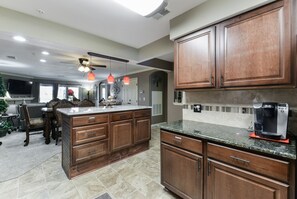 Enjoy cooking in this well-equipped kitchen with a large island and oven.