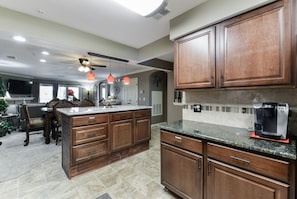 Enjoy cooking in this well-equipped kitchen with a large island and oven.